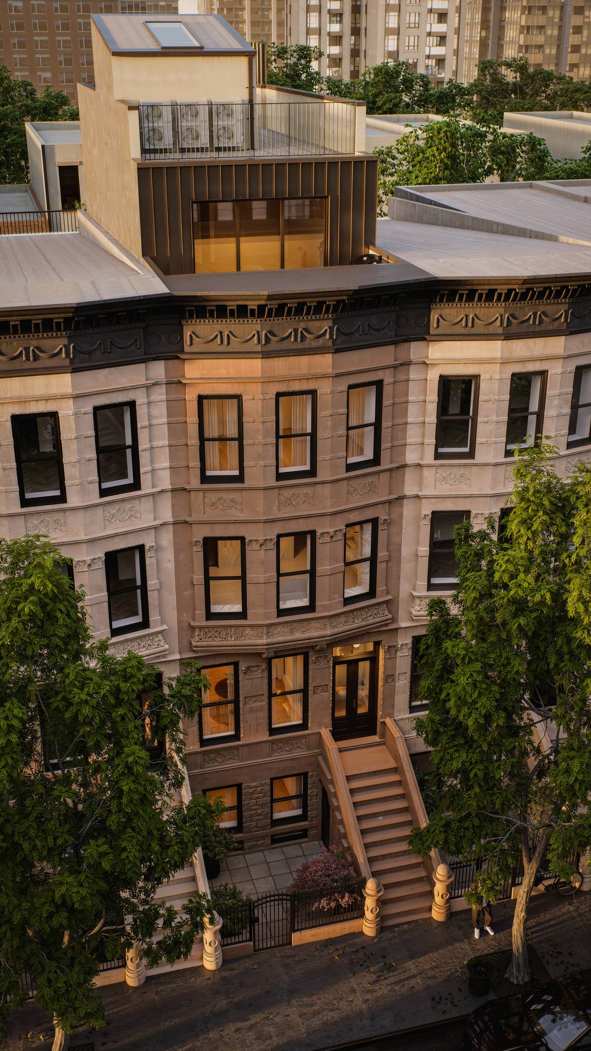 140 West 88th Street facade at dusk with rooftop addition